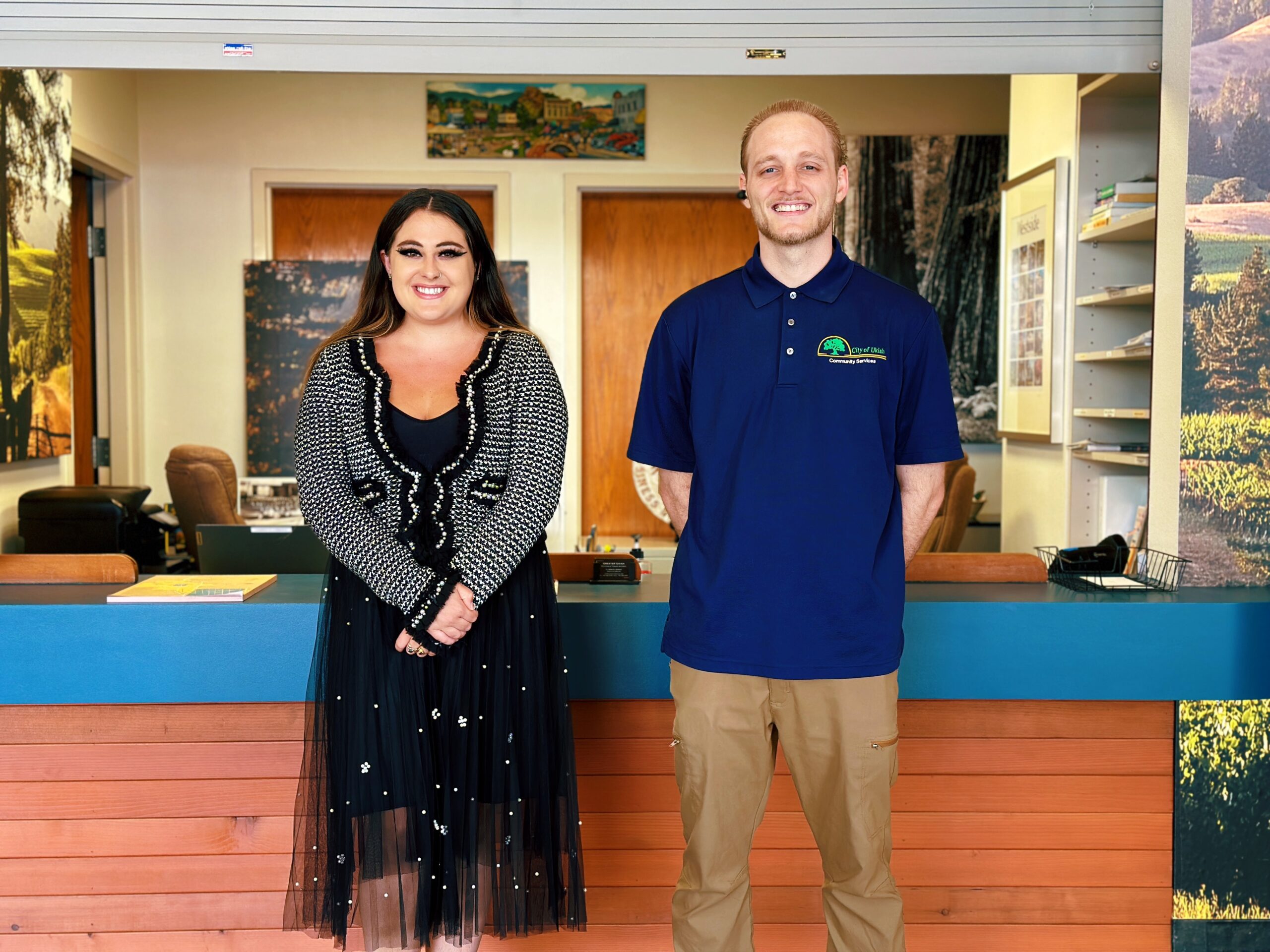 UVCC staff standing in front of welcome desk